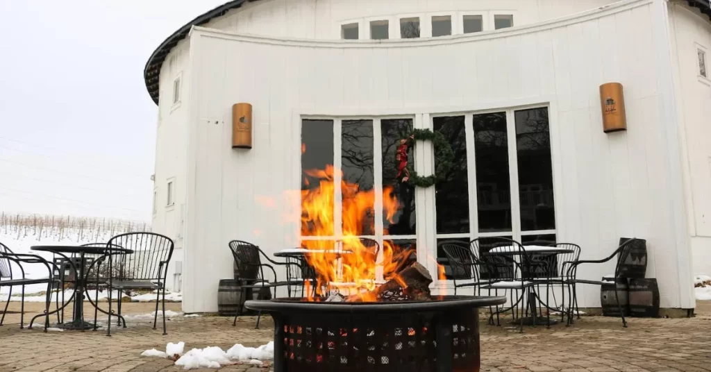 round barn winery with burning fire pit