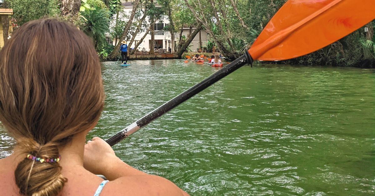 girl kayaking on river png