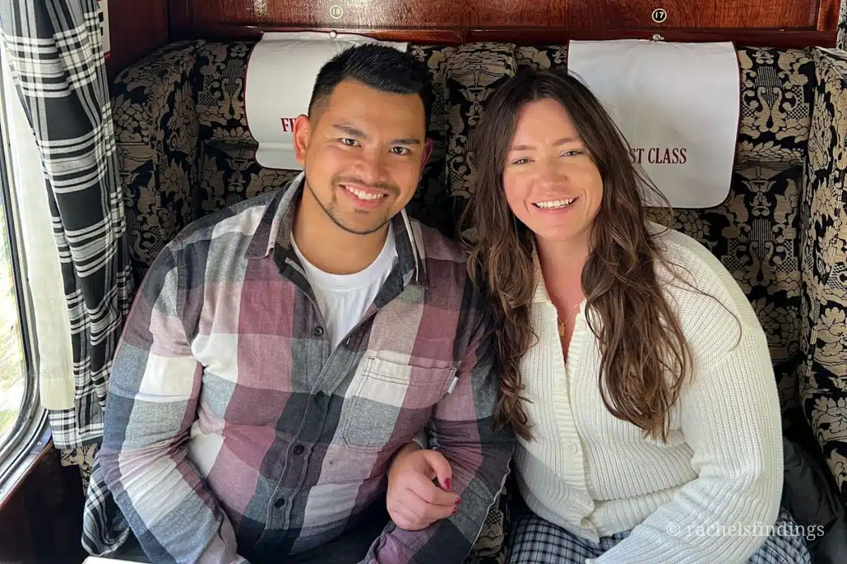 couple smiling inside the jacobite train