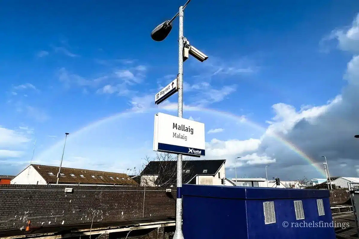 rainbow over mallaig station sign
