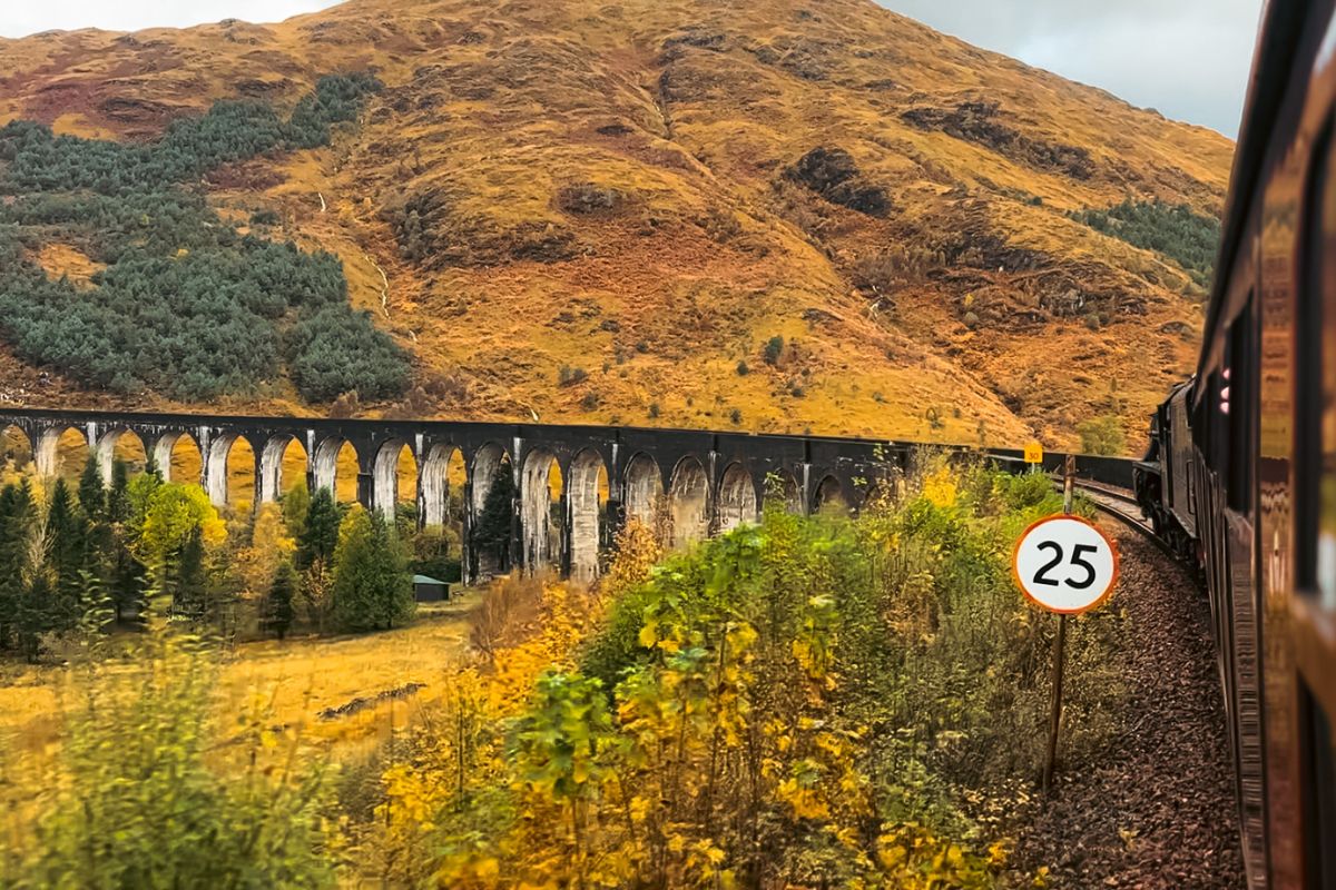 view from jacobite passing over glenfinnan viaduct uk